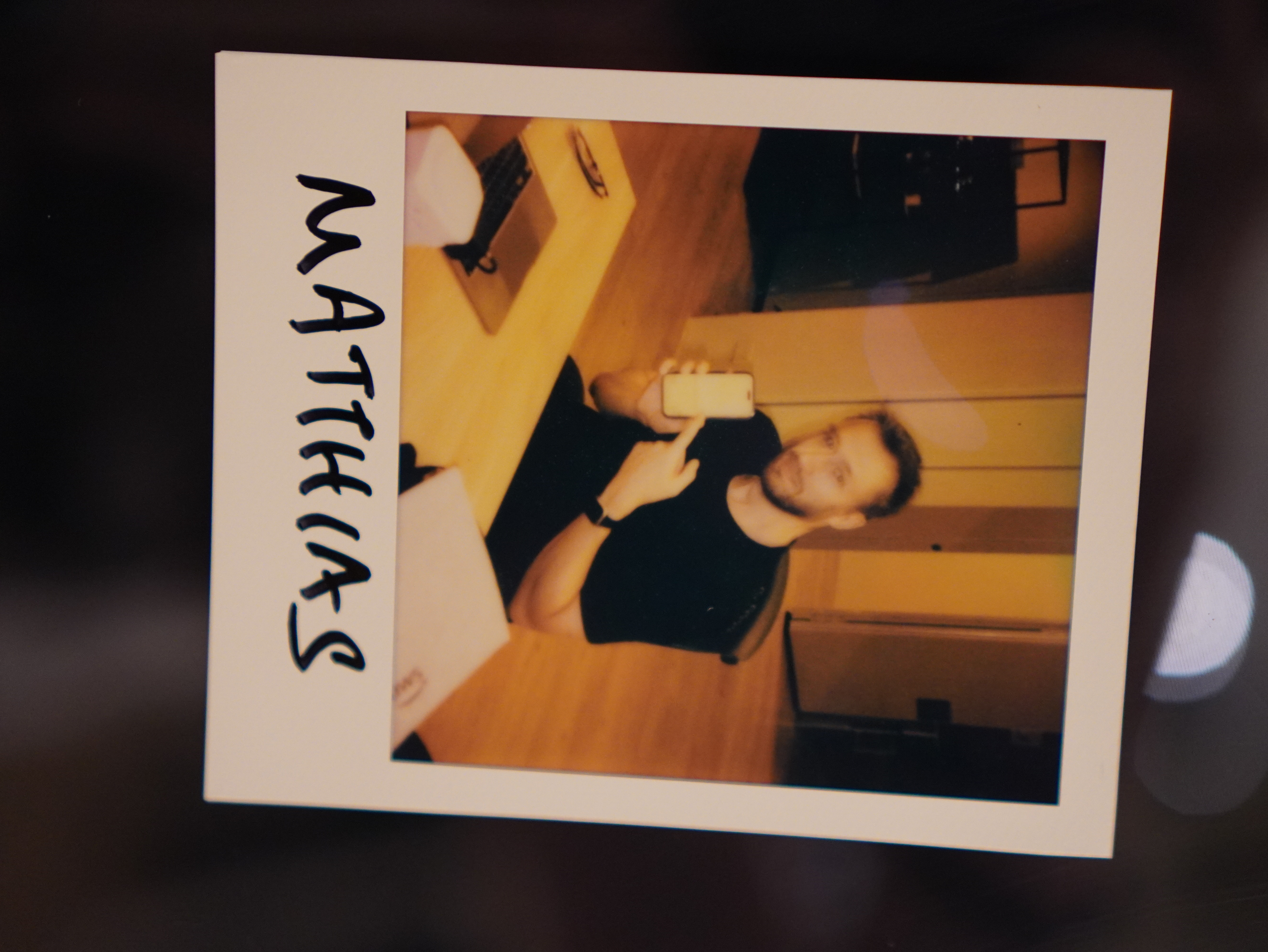 Mathias holding up the software he built